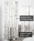 Close-up of Ophelia 22 Inch Modern Four Light Vanity Fixture with cylinder hand cut glass shades in brushed nickel finish