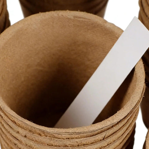 Close-up of Seedling Pots 45 Pack With Labels For Easy Germination And Root Care, showing paper pulp material with a label inside.