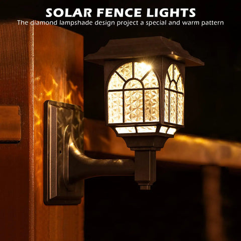 Solar Fence Lights 2 Pack Outdoor Waterproof Lanterns with Warm White LED on wooden post at night