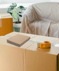 12 Pack Corrugated Cardboard Pads for Box Bottom Reinforcement and Shipping Protection on moving box with tape dispenser