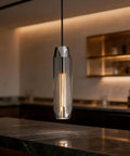 PRTSER 11.8" Modern Pendant Light Fixture with Smoke Gray Crystal Lampshade hanging over a kitchen island countertop.