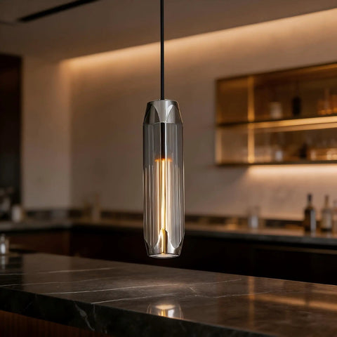 PRTSER 11.8" Modern Pendant Light Fixture with Smoke Gray Crystal Lampshade hanging over a kitchen island countertop.