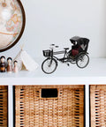 Absolutely Sweet Mini Motorcycle And Vintage Rickshaw Cake Topper With Detailed Metal Alloy Body on a shelf with a globe and decor.