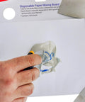 Hand using Pro Grade Multi Layered Disposable Paper Body Filler Mixing Board With 100 Sheets, Clean Resin Resistant Surface
