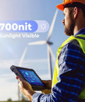 Man holding Badass Rugged Windows Tablet With 8-Inch Sunlight Readable Screen outdoors; 700 nit touchscreen visible at job site.