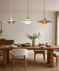 Amber Glass Pendant Light Modern: 19-inch Metal Chandeliers For Dining Room above a wooden dining table with decor.
