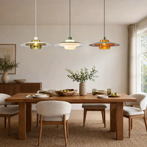 Amber Glass Pendant Light Modern: 19-inch Metal Chandeliers For Dining Room above a wooden dining table with decor.