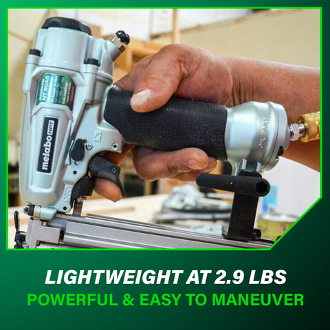 Close-up of hand holding Pro 18 Gauge Brad Nailer For Trim And Furniture Projects Pneumatic Finish Nail Gun With Aluminum Magazine