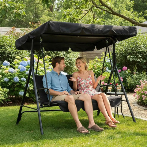 Couple sitting on Three Seat Outdoor Porch Swing With Adjustable Canopy in a garden setting