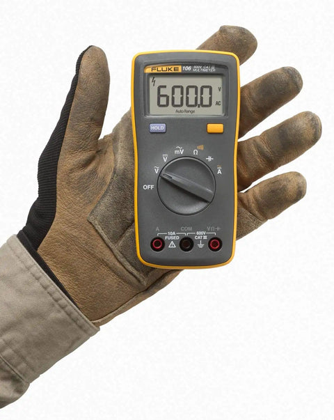 Palm Sized Digital Multimeter Handy And Snappy For Voltage And Current Readings With Resistance Continuity And Capacitance Tests 10 Amp AC And DC Current Measurement Data Hold One Hand Operation India Version held in gloved hand