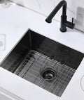 Top view of Built To Last 16 Gauge Black Stainless Steel Undermount Kitchen Bar Sink 20 By 17 By 9 Inches with grid and faucet