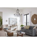 Living room with LED Stone Glass Wall Sconce in Brushed Nickel ADA Compliant, showcasing modern lighting near windows.