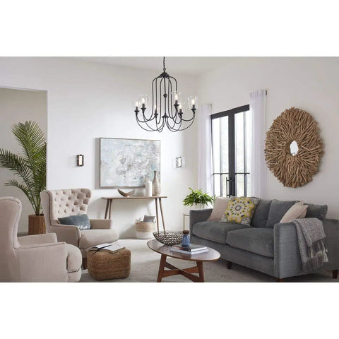 Living room with LED Stone Glass Wall Sconce in Brushed Nickel ADA Compliant, showcasing modern lighting near windows.