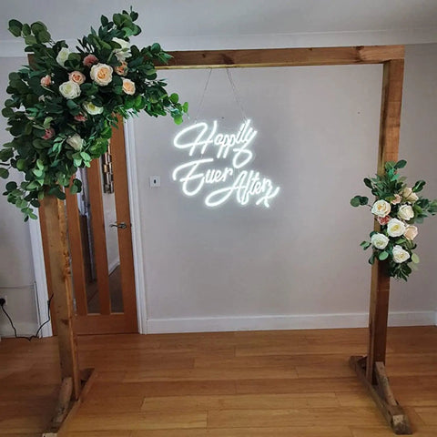 Happily Ever After Neon Sign With Custom Wedding Wall Decor Flexible LED Neon Light for Weddings Anniversaries Parties Home Decor and Photo Backdrops Ideas on wooden frame with floral decoration.