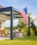 Smooth As Butter 360 Rotating Flag Pole Rings 2 Pack Heavy Duty Aluminum Alloy Mounting Clips displaying an American flag outdoors.