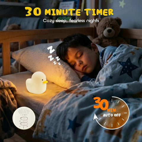 Young boy sleeping with Cute Duck Night Light For Nursery And Bedroom, Rechargeable Silicone Baby Lamp. Cozy sleep aid for kids.