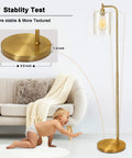 Gold Industrial Floor Lamp With Glass Shade For Living Room And Bedroom Vintage Brass Standing Lamp With E26 Socket And Foot Switch Modern Rustic Lighting Dope Vibe next to a sofa and child highlighting stability