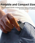 Person placing Juiced Up Battery Handle With Digital Display For DJI Osmo Pocket 4 And Pocket 3 into pocket