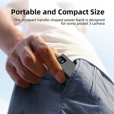 Person placing Juiced Up Battery Handle With Digital Display For DJI Osmo Pocket 4 And Pocket 3 into pocket