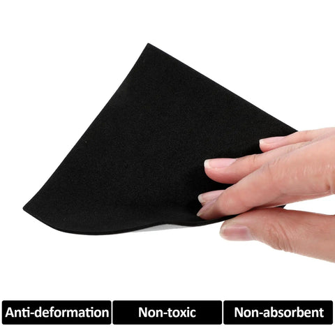 Twenty Two Piece Adhesive Foam Squares With Heavy Duty Hold Anti Slip Soundproof Cushioning For Rock Solid Vibration Dampening Furniture Sliders No Fuss Black Backing shown in hand, flexible black EVA foam.