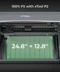 xTool P2 honeycomb working panel 2.0 installed in laser engraver; green honeycomb surface, 24.8 x 12.8 inches