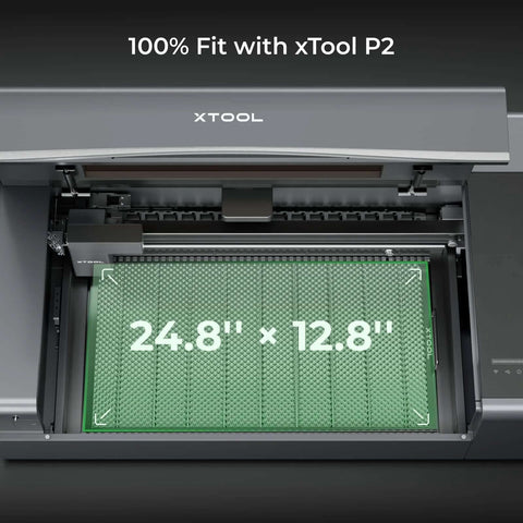 xTool P2 honeycomb working panel 2.0 installed in laser engraver; green honeycomb surface, 24.8 x 12.8 inches