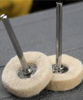 Pro Grade Wool Felt Polishing Wheel Kit 60 Pcs 25mm buffing wheels with 3mm shank close-up on gray surface