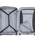 Open view of DELSEY PARIS Titanium silver hardside expandable 25-inch luggage interior with cross straps and zip pocket