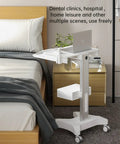 Mobile Medical Trolley Cart With Laptop Tray And Oral Scanner Holder beside a bed in a room