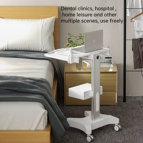 Mobile Medical Trolley Cart With Laptop Tray And Oral Scanner Holder beside a bed in a room