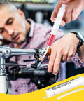 Using Brake Bleed Kit For Shimano Hydraulic Brakes With Mineral Oil 120ml on bike handlebar in workshop setting