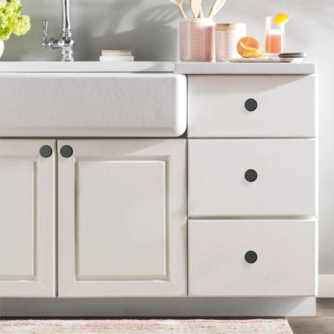 Matte Black Cabinet Knobs 10 Pack Kitchen Drawer Hardware Modern Cabinet Pulls on a white bathroom vanity with drawers.