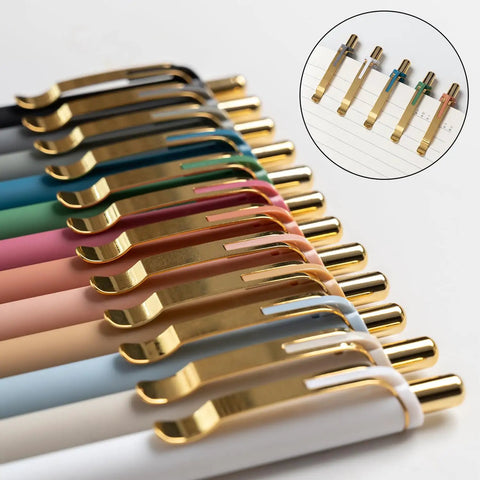 Gold 12 Pack Retractable Ballpoint Pens With Ultra Soft Grip 1.0mm Point Smooth Black Ink For Effortless Everyday Writing Comfortable Non Slip Grip For Men And Women arranged in a row with gold accents
