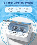 Ultrasonic Jewelry Cleaner Pro 47kHz Deep Cleaning Machine With Three Cleaning Modes For Retainers Mouth Guards Watches Rings Diamonds White Dope Cleaning Power shown with glasses.