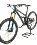 Side view of Scorpion Moto Style Portable Bike Stand With Bottom Bracket Crankarm Support For Road MTB Cyclocross And Ebike Two Piece Black