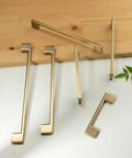 Five Pack Classic Cabinet Handles Champagne Bronze Zinc Alloy Furniture Pulls displayed on table, modern design, various angles.