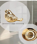 Upgrade Your Bath Setup With These Fresh Golden Bird Ceramic Toilet Bolt Caps, 4 inch hand painted bird detail with a 1 inch connection.