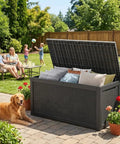 Big Ol 320 Gallon Resin Deck Box Waterproof Outdoor Storage Chest With Lockable Lid UV Resistant For Patio Furniture Pool Accessories Garden Tools Cushions And More In Black on patio with family and dog