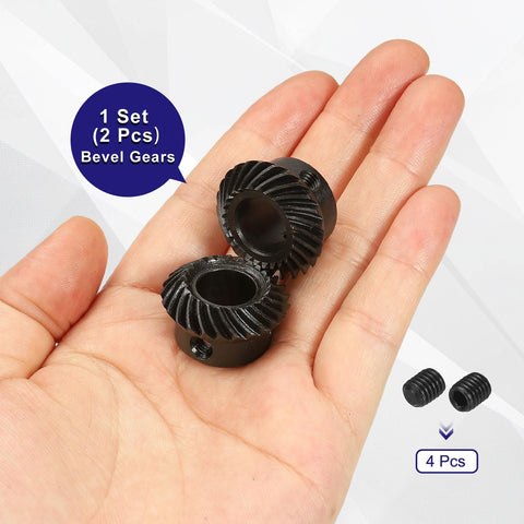 Hand holding Two Piece 90 Degree 1 To 1 Spiral Bevel Gear Set Ground Mod 1 12mm Bore 25 Teeth Each Left Hand And Right Hand