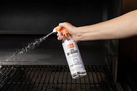Heavy Duty Grill Cleaning Kit with Exterior Detailing Spray and Foaming Degreaser Scraper and Pad Microfiber Towels and Nitrile Gloves Built for Grill Masters Smokers Ovens and Griddles in use on grill