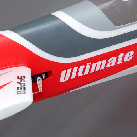 Close-up of Ultimate 3D 950mm RC Airplane With AS3X Safe Technology Smart BNF Basic Ready To Fly fuselage in red and grey.