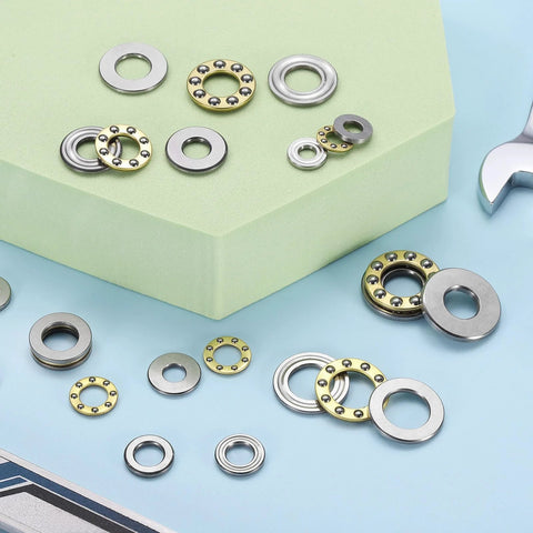 uxcell F8-22M thrust ball bearings with washers, chrome steel, 8 pcs, 8x22x7 mm, scattered on blue surface