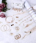 Must Have 38 Piece Jewelry Set For Women With Four Necklaces Ten Bracelets And Twenty Four Layered Ball Hoop Earrings Lightweight Alloy Fashion Jewelry For Everyday Glam Eco Friendly And Colorfast Gift Ready. gold-tone set on white fur
