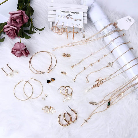 Must Have 38 Piece Jewelry Set For Women With Four Necklaces Ten Bracelets And Twenty Four Layered Ball Hoop Earrings Lightweight Alloy Fashion Jewelry For Everyday Glam Eco Friendly And Colorfast Gift Ready. gold-tone set on white fur