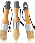 Super Slick Three Piece Chalk Wax Paint Brush Set For Furniture Makeovers showing three wooden handled brushes with hog bristles.