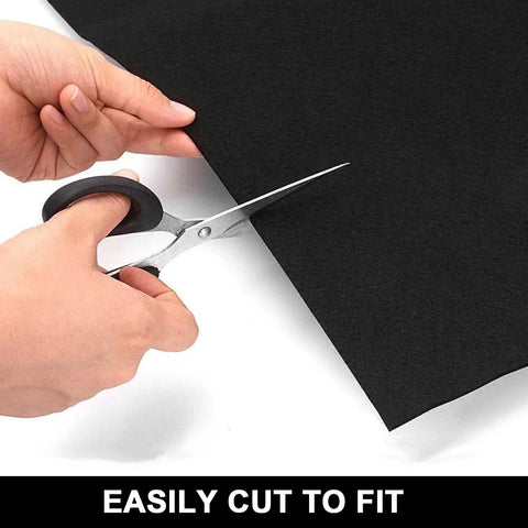 Person cutting Garage Floor Mat 30 X 36 Inches Heavy Duty Oil Spill Absorbent Mat With Waterproof Backing to fit size.