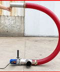 Red hose Grab And Go Portable Grain Pumping Suction Auger Screw Conveyor for small grains, wear resistant, in outdoor setting.