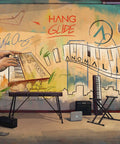 Colorful mural with music keyboard, green leaves, and city skyline for hang gliding inspiration.