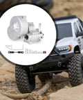 Beefed Up Aluminum Alloy RC Transmission Gearbox For 1-10 Scale Crawler Cars, Metal Gearset Upgrade Replacement, shown beside RC car