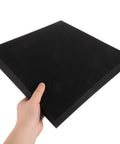 Hand holding black high density foam insert for packaging and tool boxes that stand up to deformation, heavy duty polyurethane padding